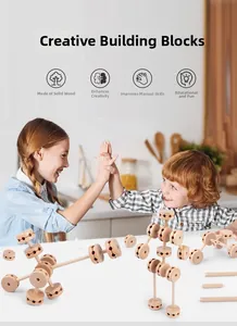 Children celebrating with a creative wooden building block structure in a home setting