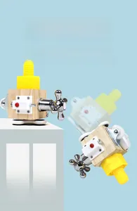 Detail showing interactive metal faucet handle and red button on wooden busy cube toy