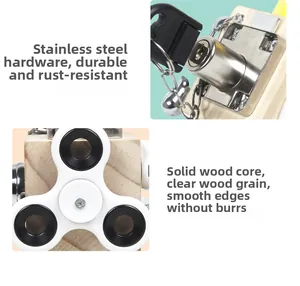 Detail of stainless steel locks and fidget spinner on a wooden Montessori busy cube toy