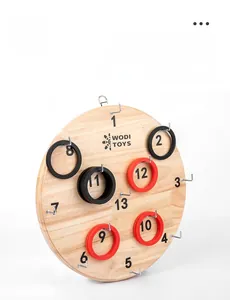 Detail view of the wooden ring toss game board with thirteen metal hooks and score numbers