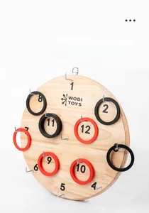 Close-up of wooden ring toss game board with numbered hooks and colorful rings