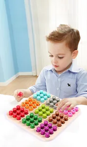 Toddler playing with wooden Sudoku toy for color recognition and number learning