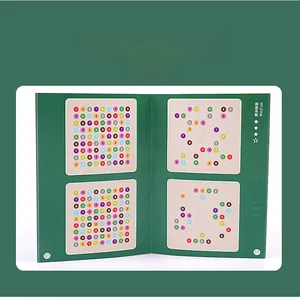 Detailed view of the medium difficulty Sudoku puzzle booklet with colorful answer keys