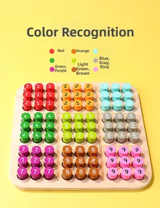 Close-up of wooden Sudoku board with colorful numbered cylinders for early learning