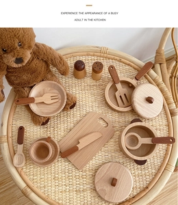Macro detail of natural wooden toy kitchen set featuring polished bowls and utensils
