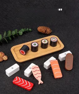 Detail of wooden sushi toy set showing magnetic connection pieces on a display tray