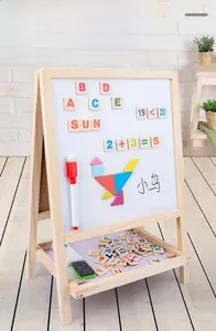 Detail of wooden 2-in-1 magnetic easel with colorful alphabet magnets and drawing tools