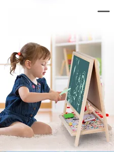Young girl drawing on a foldable 2-in-1 wooden magnetic chalkboard with accessories