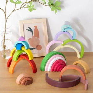 Rainbow wooden stacking block sets in various colors for creative building and early learning