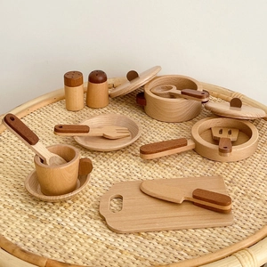 Close-up of wooden pretend play kitchen cookware set with smooth natural wood finish