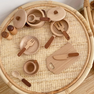 Detailed macro view of wooden play kitchen utensils set on a woven tabletop background