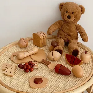 Detailed view of children's wooden play food set with cutting board and toy knife