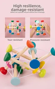 Macro detail of high-elasticity sensory ball with colorful wooden beads for baby grip training