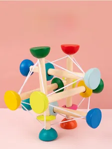 Detail of colorful wooden sensory toy for children with elastic cords and round beads