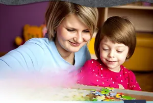 Close-up of colorful wooden animal puzzle pieces for toddler early educational learning