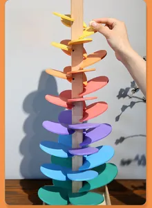 Detailed view of wooden rainbow music tree toy with colorful cascading sound leaves
