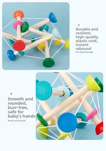 Detail of wooden Skwish style baby sensory toy showing elastic ropes and smooth beads