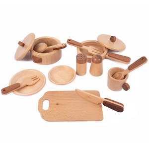Detail of wooden kitchen toy set featuring miniature pots, plates, and utensils