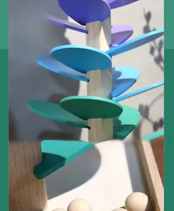 Detail view of colorful wooden musical singing tree petals with spiral assembly design