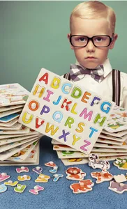 Close-up of wooden alphabet puzzle with easy-to-grip knobs for toddler learning