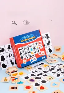 Detail of wooden shadow matching puzzle pieces with animal and fruit shapes for kids