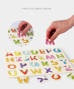 Detail showing wooden letter puzzle pegs with stroke sequence guides for kids