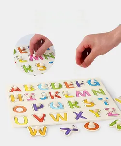 Detail showing wooden letter puzzle pegs with stroke sequence guides for kids