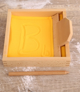 Wooden Montessori sand tray with tools for kids to practice writing letters and sensory skills