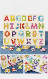Detail of wooden alphabet puzzle featuring easy-grip knobs and stroke order guides