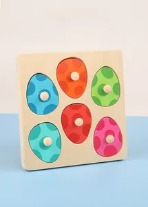 Detail of wooden dinosaur egg puzzle with 6 colorful pegged pieces for toddler motor skills