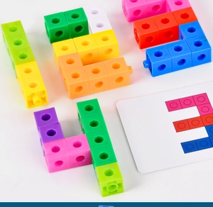 Close-up of colorful linking math cubes with interlocking pegs and instructional cards