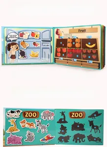 Close-up of interactive busy book pages showing fruit and zoo animal stickers for toddlers