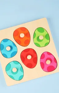 Macro view of wooden 3D dinosaur egg puzzle with colorful grip knobs for early learning