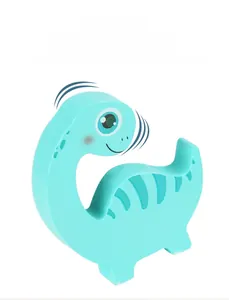 Detail of blue wooden dinosaur toy with rounded edges and smooth cartoon printing