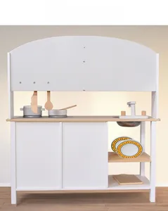 Front view of modern wooden play kitchen with white cabinets and realistic cookware