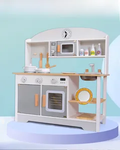 Detailed view of white and grey wooden toy kitchen with knobs, faucet, and cooktop