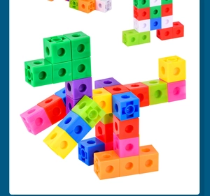 Macro shot of colorful plastic linking cubes building a creative toy dinosaur shape