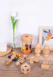 Detail of Montessori wooden baby rattle set including beads and geometric shapes