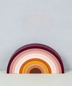 Detailed view of 10-layer wooden rainbow arch blocks in soft Morandi colors