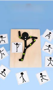 Macro shot of wooden puzzle base with movable joint mannequin and action reference cards