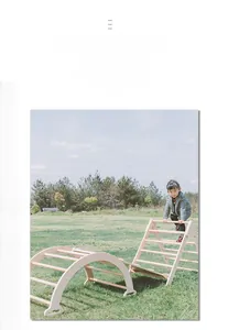 Outdoor view of kids solid wood Pikler triangle and climbing arch set on green grass