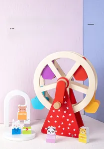 Detail of wooden ferris wheel toy with colorful animal figures on blue background