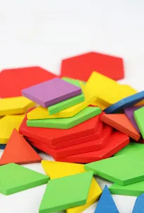 Macro view of colorful geometric wooden puzzle blocks including hexagons and triangles