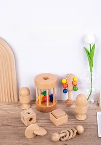 Macro view of natural wooden baby rattles and stacking toys with smooth rounded edges