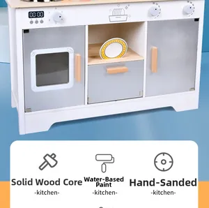 Detail of wooden toy kitchen with oven dials and natural wood handles for children