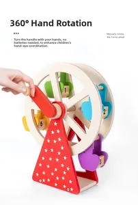 Detailed close-up of a hand rotating the mechanical wooden ferris wheel educational toy