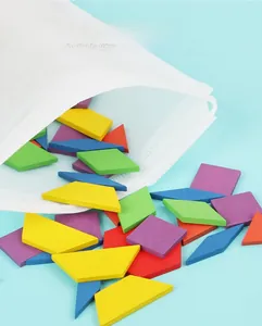 Close-up of colorful wooden geometric puzzles pouring out of a white drawstring storage bag