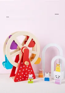 Detail of wooden ferris wheel toy with colorful animal blocks on a decorative stand
