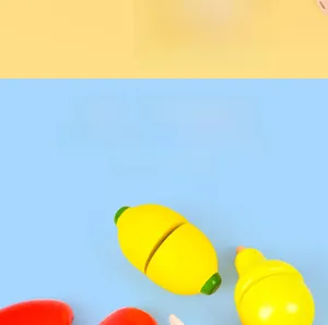 Detailed view of wooden play food set with sliceable lemon and pear for toddlers