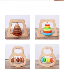 Four different natural wooden baby rattle designs with colorful beads and smooth rings